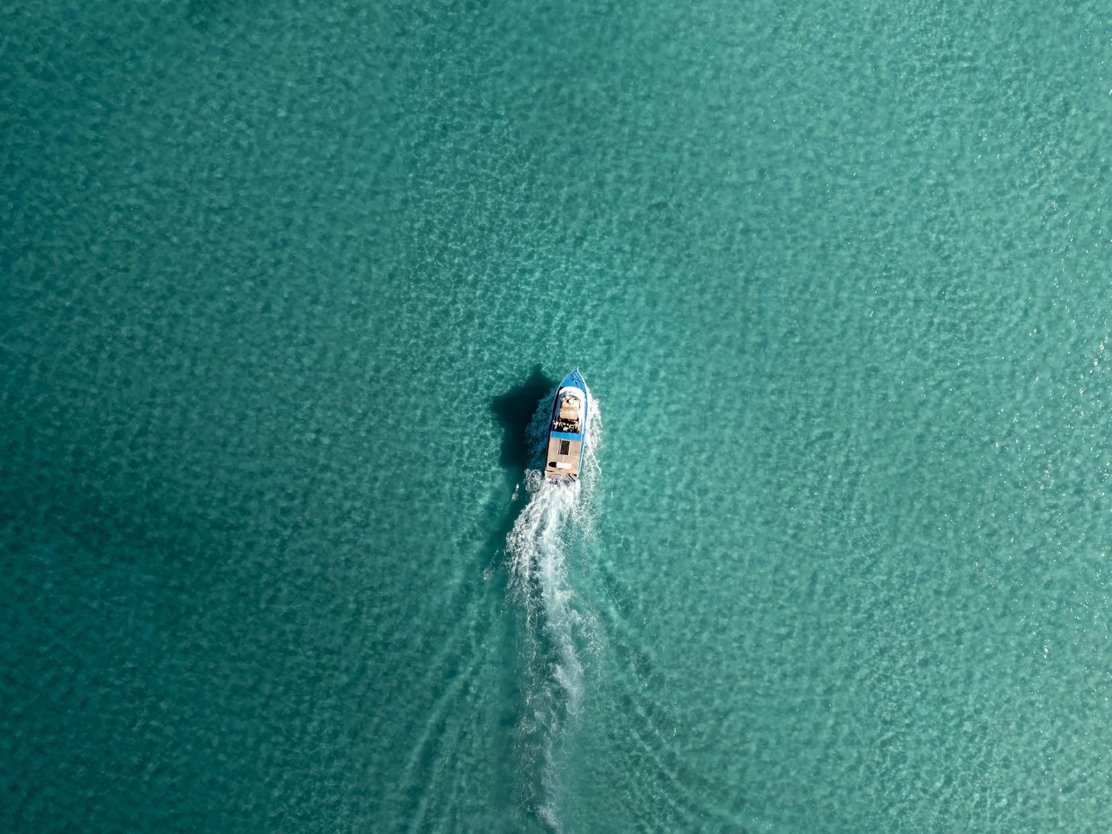 Example: a speedboat over turquoise water